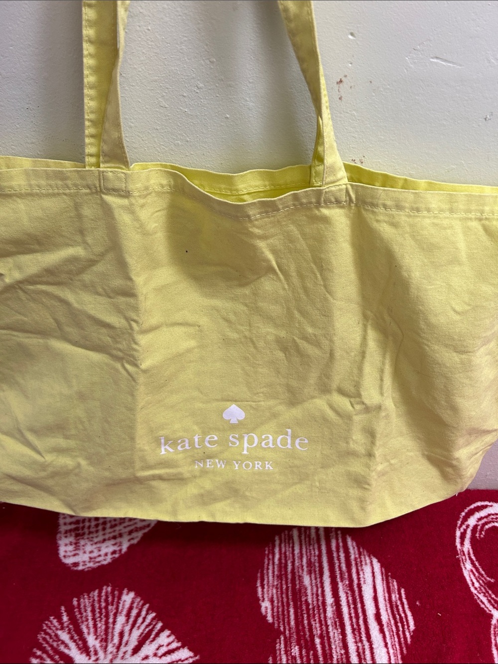 kate spade yellow canvas tote with white logo
